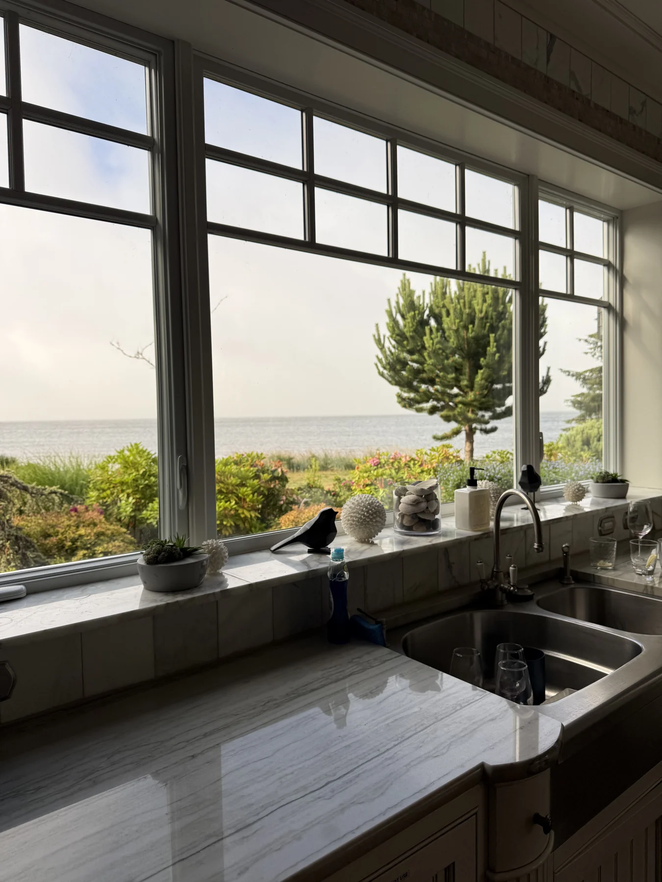 The estate kitchen with a window view of the water