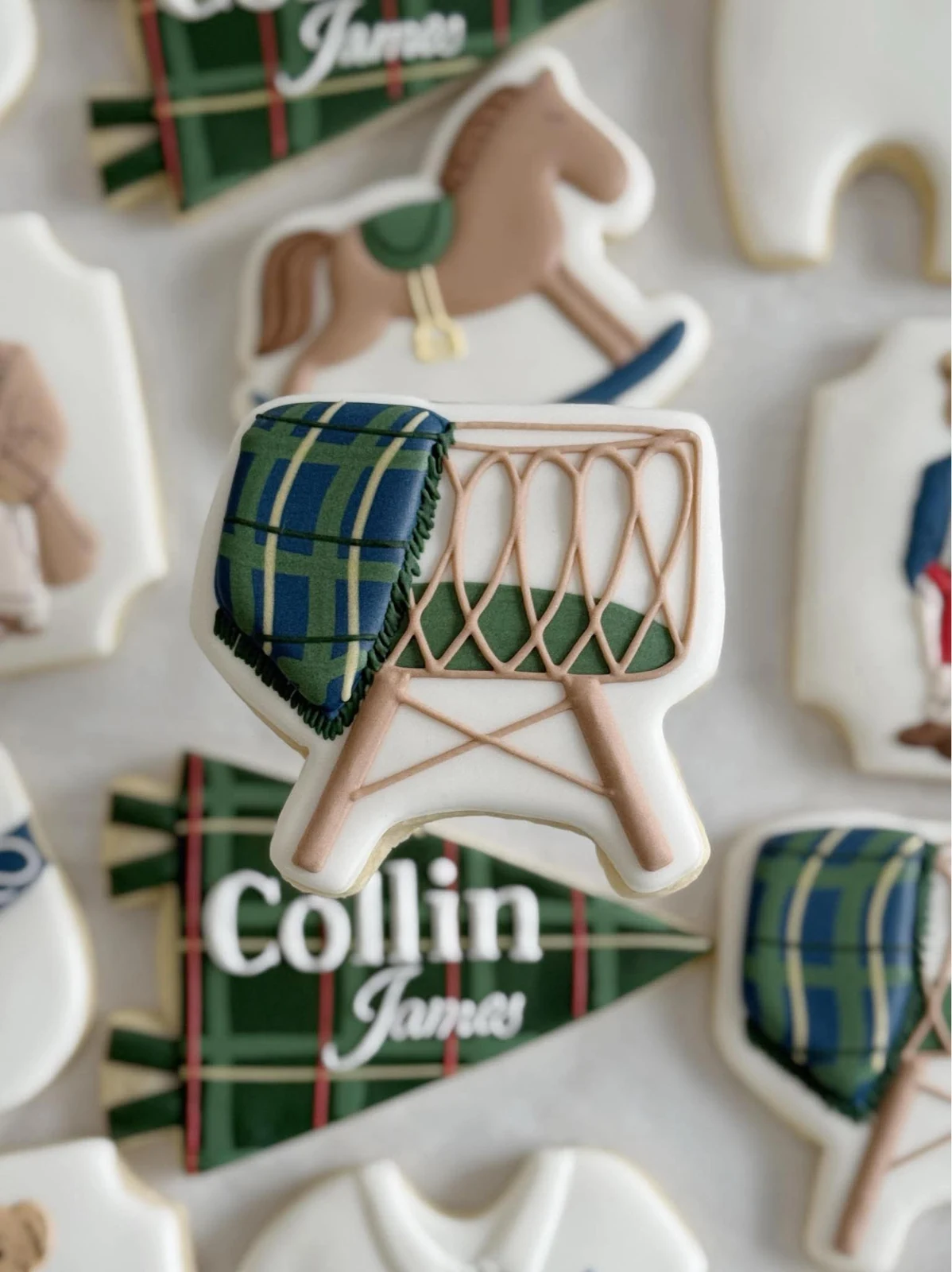 Close-up of plaid drum and monogram cookies for Collin James