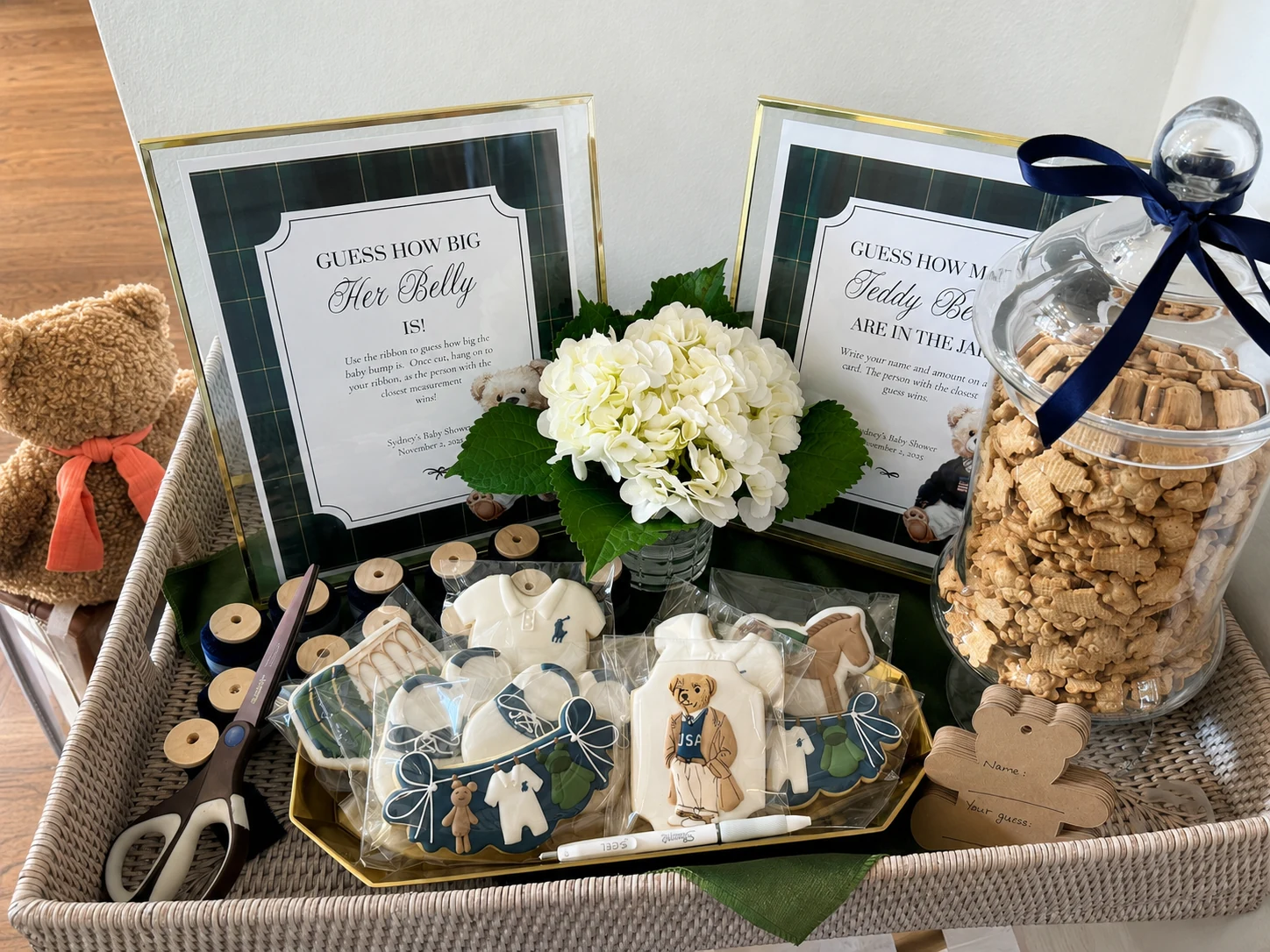 Guess How Big Her Belly Is game sign, keepsake basket, flowers, and custom cookie details