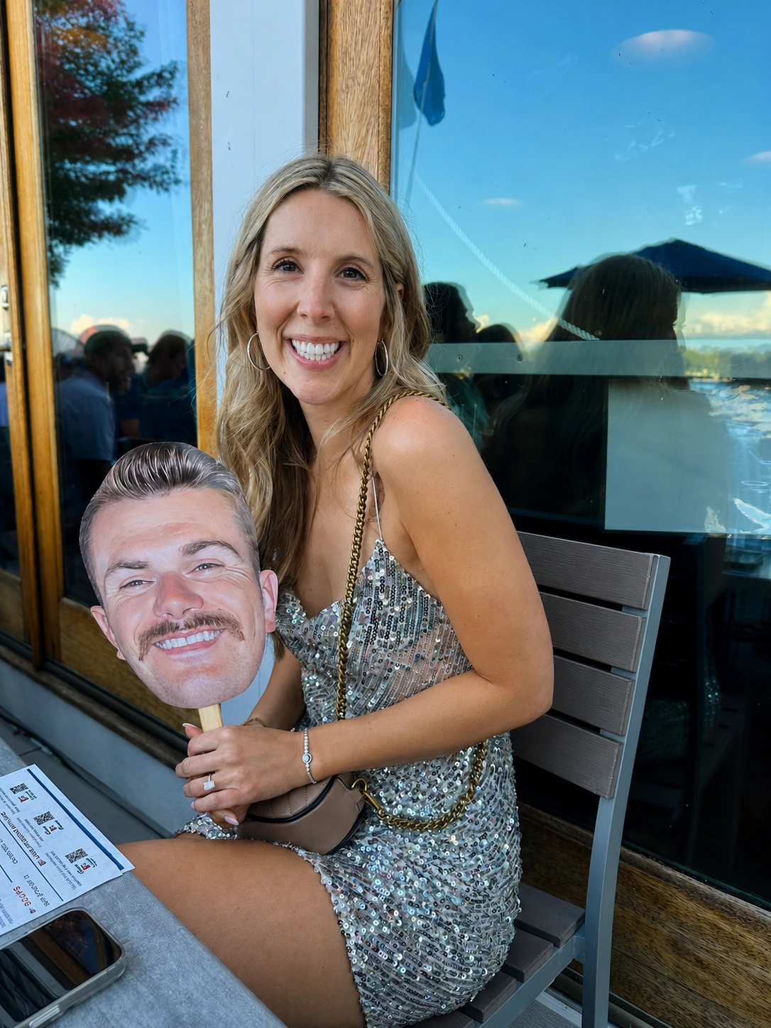 Bride enjoying the custom face cutout during the Lake Geneva bachelorette