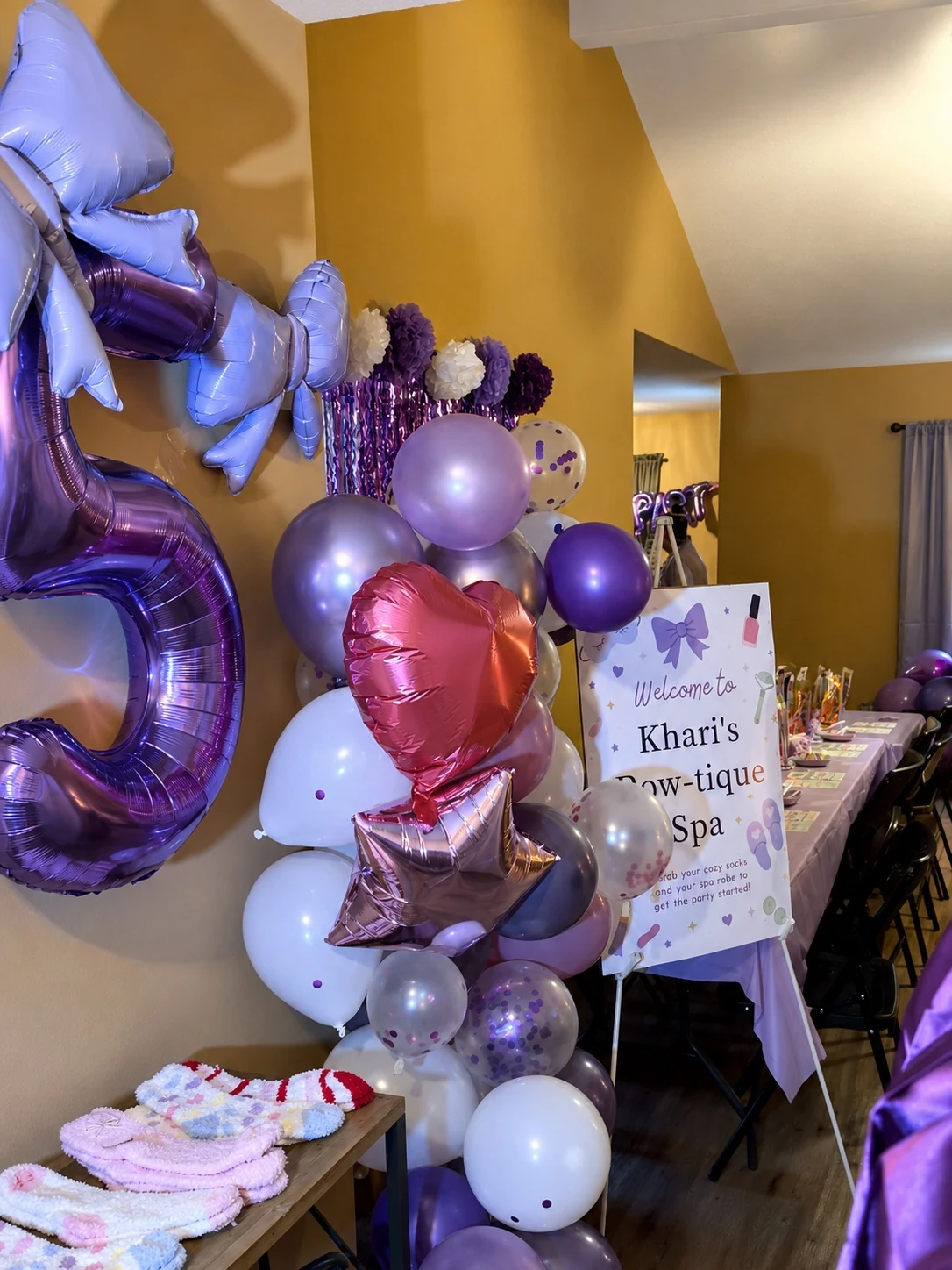 Welcome sign and balloon installation for Khari's Bow-tique Spa party