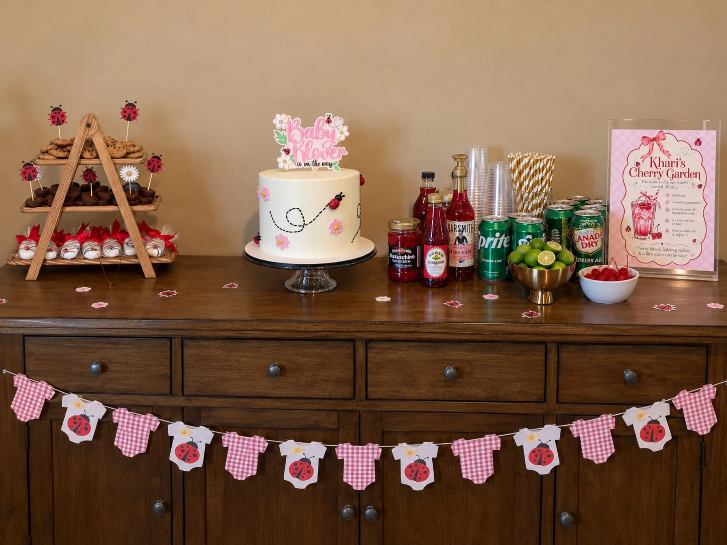 Dessert table with ladybug treats, custom cake and Khari's Cherry Garden drink setup