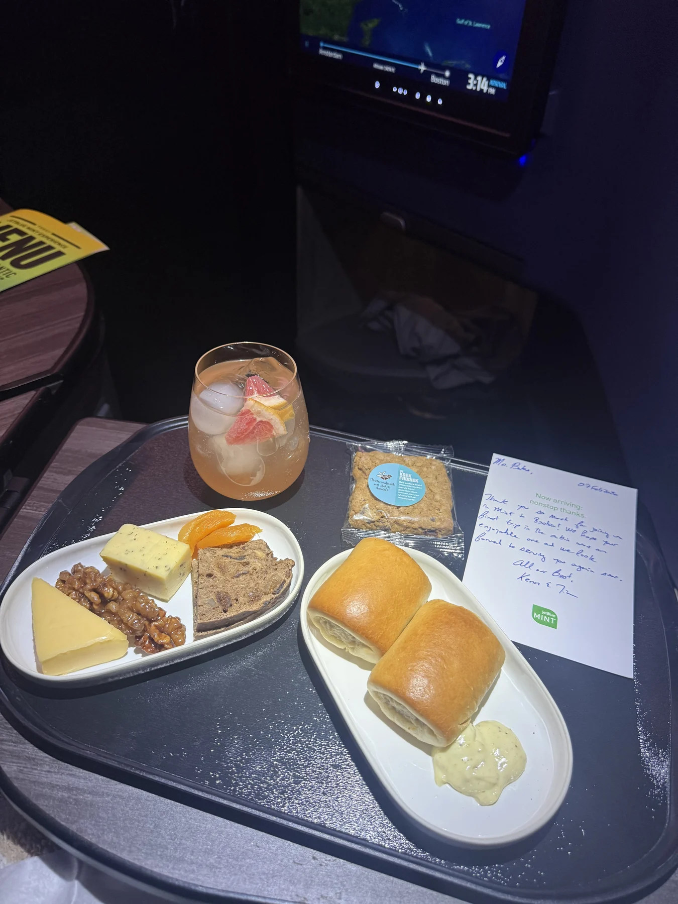 A JetBlue Mint tray with food and drinks