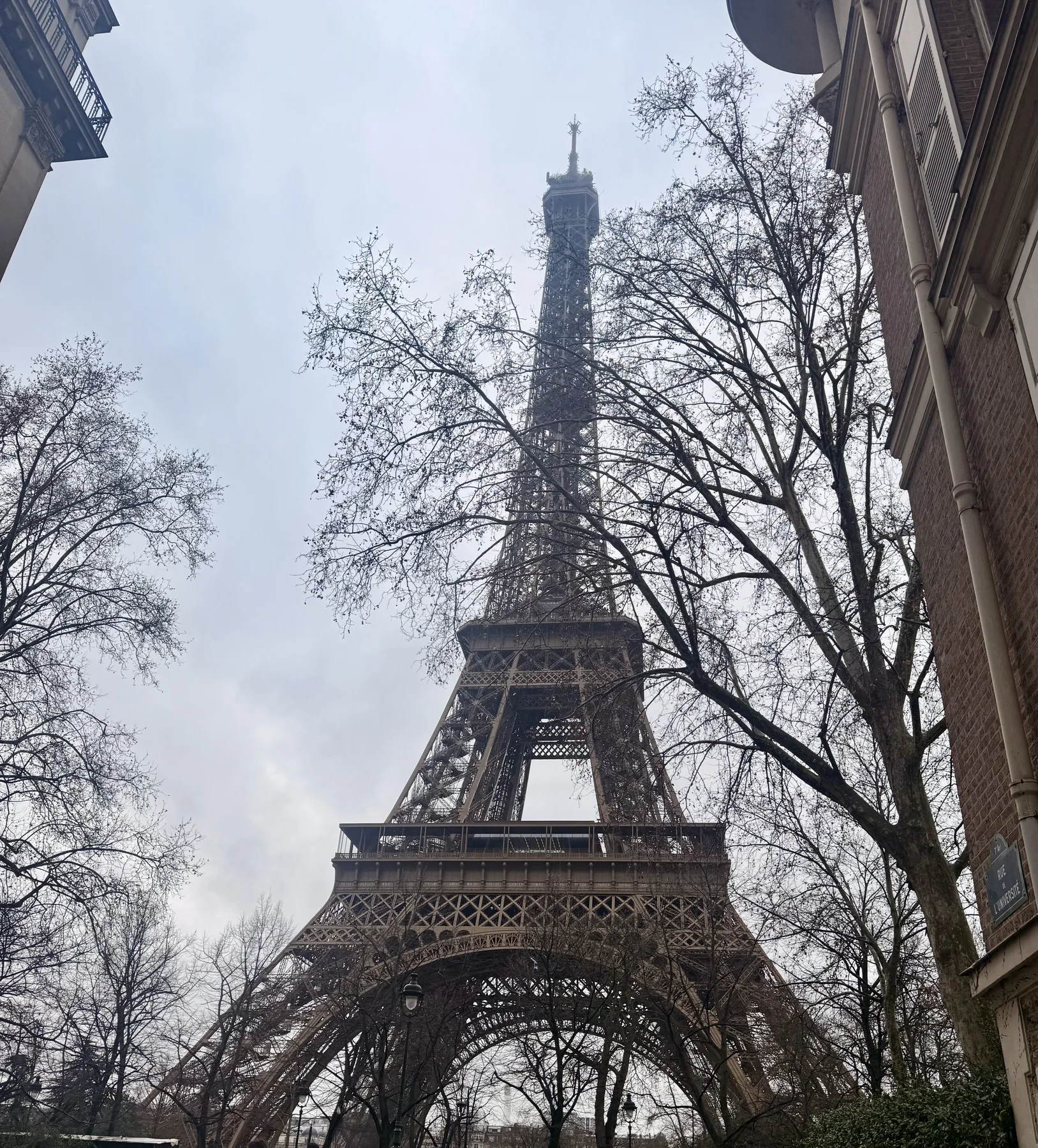 The Eiffel Tower seen from a Paris street