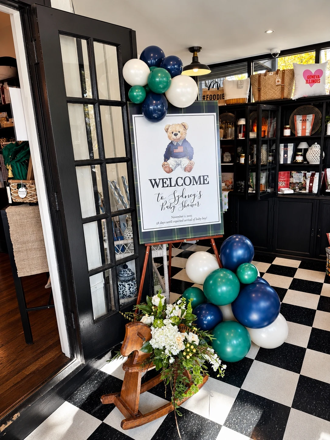 Collin James welcome sign with blue and green balloons at the entry